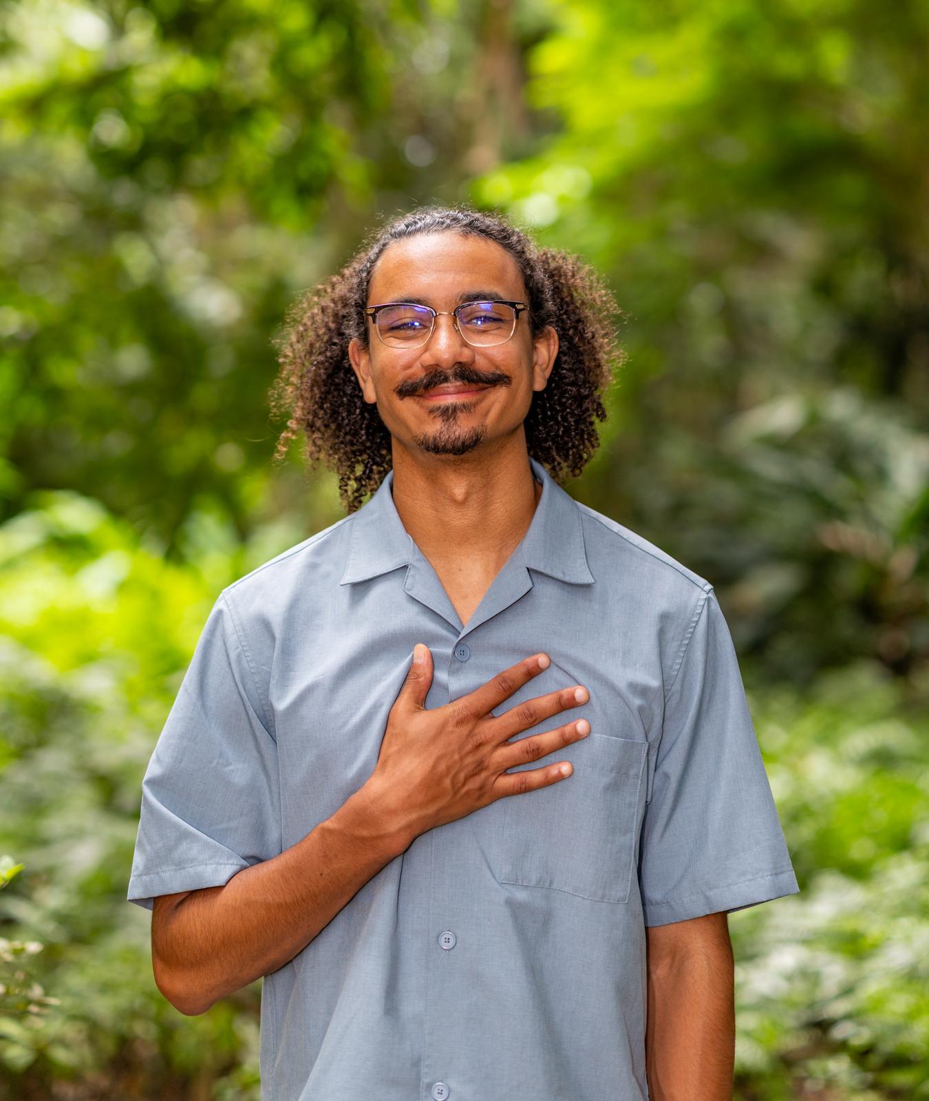 Greenhouse member holding a young plant